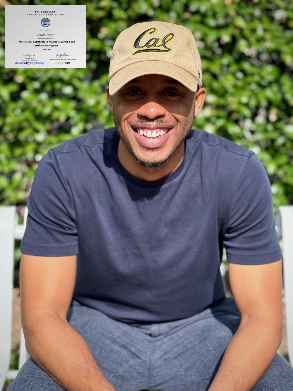 Isaiah Hayes smiling confidently in a professional portrait