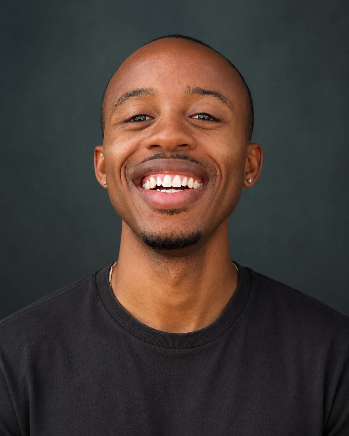 Isaiah Hayes smiling confidently in a professional portrait